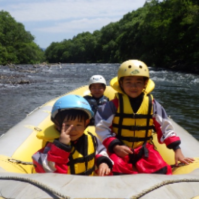 Children on a rafting boat
